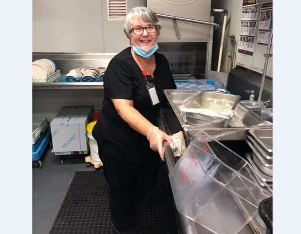 An assisted-living facility isn’t allowing visitors. This woman became a dishwasher there to see her husband.