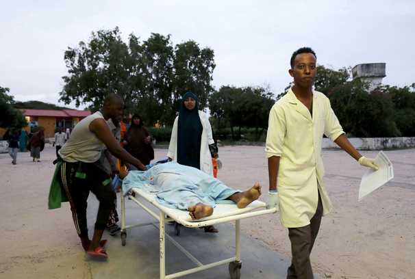 Al-Shabab gunmen storm a beachside hotel in the Somali capital, killing 11