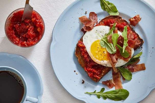 Luscious tomato jam dresses up fried egg and crispy prosciutto toasts