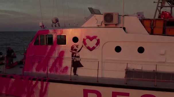 Migrant rescue boat funded by street artist Banksy pleads for aid from Europe