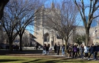 Image: Yale students make their way past Sterling Memorial Library in January. On July 1, Yale announced it would reopen in the fall with a mix of online and in-person classes.