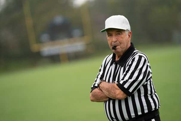 He has refereed high school football since 1963. At age 84, he’s not sure it’s safe to return.