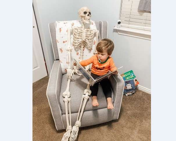 This toddler drags a life-size skeleton everywhere he goes. It’s the distraction we need.