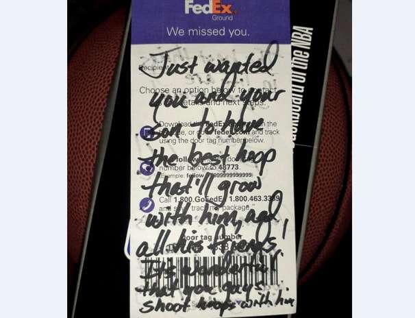 A FedEx driver saw a boy play basketball with a rusty hoop. She went to a store and bought him a new one.