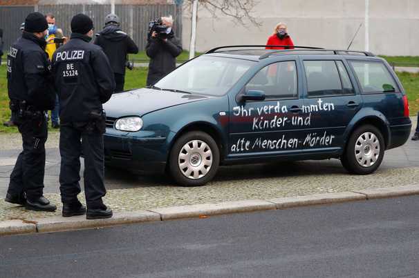 Car bearing slogans drives into gate of German Chancellor Merkel’s office