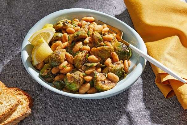 This smoky white beans and Brussels sprouts dish is good with canned beans, but ethereal with dry