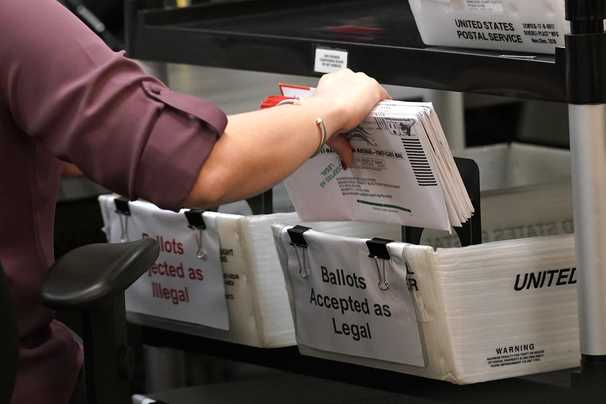 USPS and civil rights groups reach deal to fast-track ballots in Georgia runoff elections