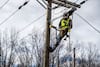 Crews work to hang fiber-optic cable in Amherst, Va., on Dec. 1. The cable will allow rural residents in Amherst and Nelson counties to have access to high-speed Internet service. (Kendall Warner/News & Advance/AP)