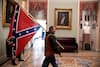 Authorities say Kevin Seefried, of Delaware, was pictured carrying a Confederate flag inside the Capitol.