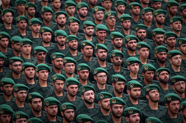 They dream of reaching America. Their forced service in Iran’s Revolutionary Guard locks them out.