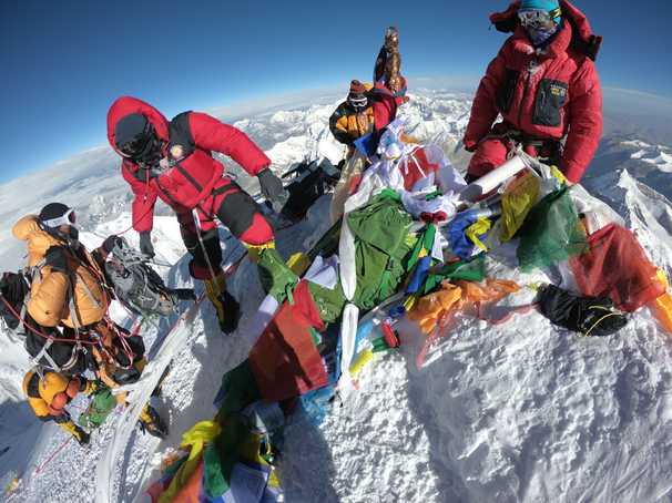 An often-overcrowded Everest has reopened to climbers. Some are questioning the decision.
