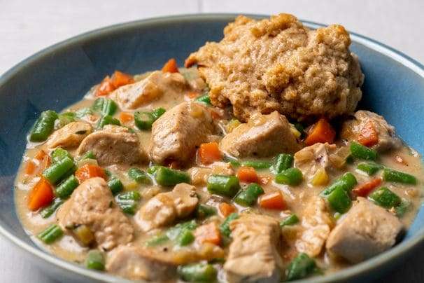 Creamy skillet chicken with biscuits gets a healthful upgrade without losing flavor