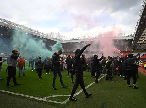 Manchester United match postponed after fans invade Old Trafford in protest of American owners