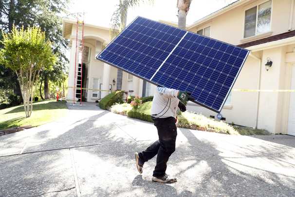 Solar panel use heats up as installation costs fall