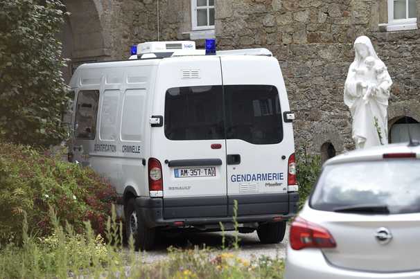 Man who set fire to a French cathedral is arrested in the killing of a Catholic priest, prosecutors say