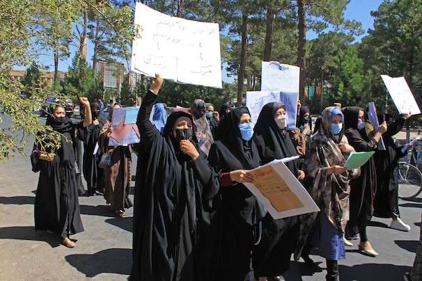 In rare public display, dozens of women in Afghanistan protest Taliban rule and gender-based violence