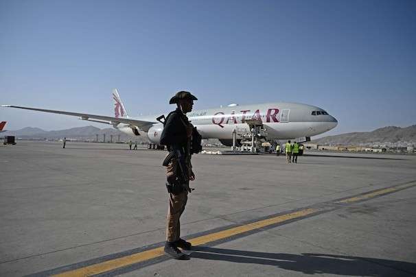 Scores of Afghan dual nationals, including Americans, leave from newly reopened Kabul airport