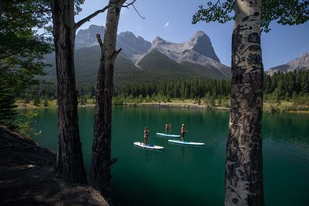 Go to Banff National Park, stay in the neighboring town of Canmore