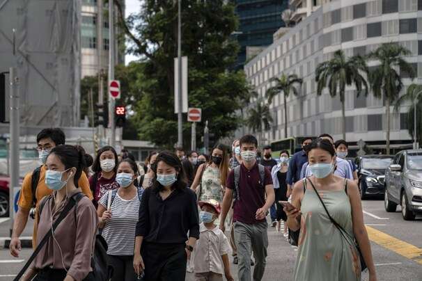 Singapore, Oh So Carefully, Lets Down Its Masks