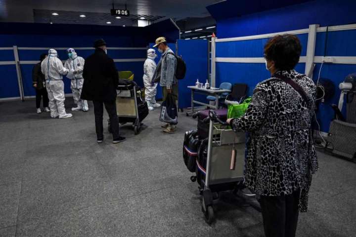 China slashes covid quarantine for travelers, but remains outlier