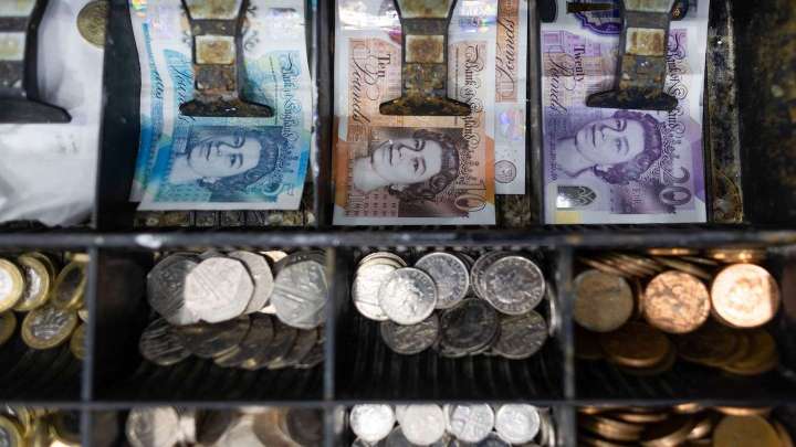 British pound falls to all-time low against dollar after taxes slashed