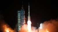 China launches crew to recently completed space station