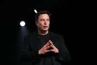Elon Musk’s first big Twitter product paused after fake accounts spread
