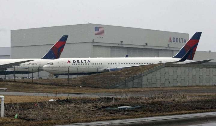Icy taxiway causes Delta plane landing in Minneapolis to slide off pavement into snow