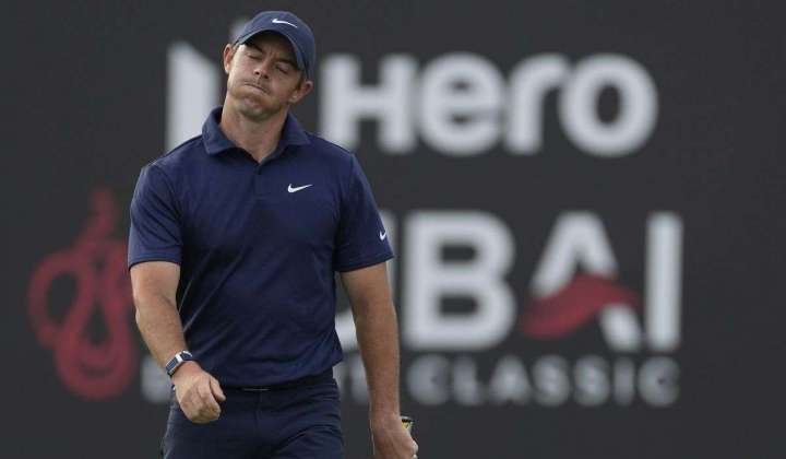 McIlroy, Reed tied behind leaders at Dubai Desert Classic