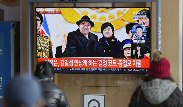 Kim Jong-un shows off daughter, missiles at North Korean parade