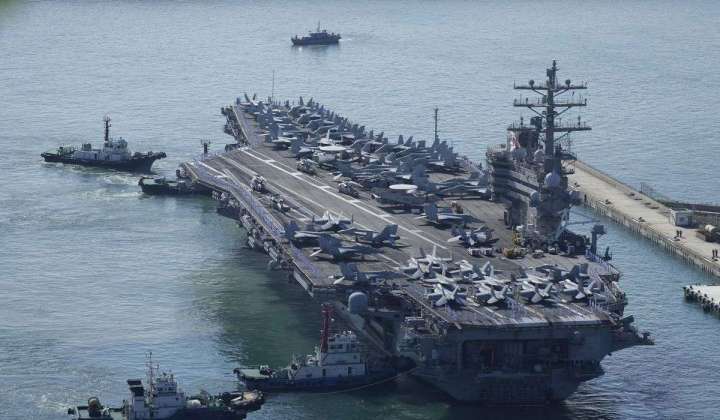 A U.S. aircraft carrier will make a rare Vietnam port call as countries compete for favor in SE Asia