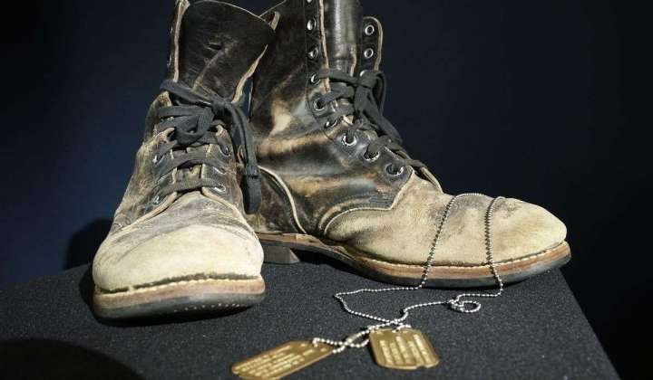 Boots and dog tags Alan Alda wore on ‘M-A-S-H’ sell at auction for $125,000 that will go to charity