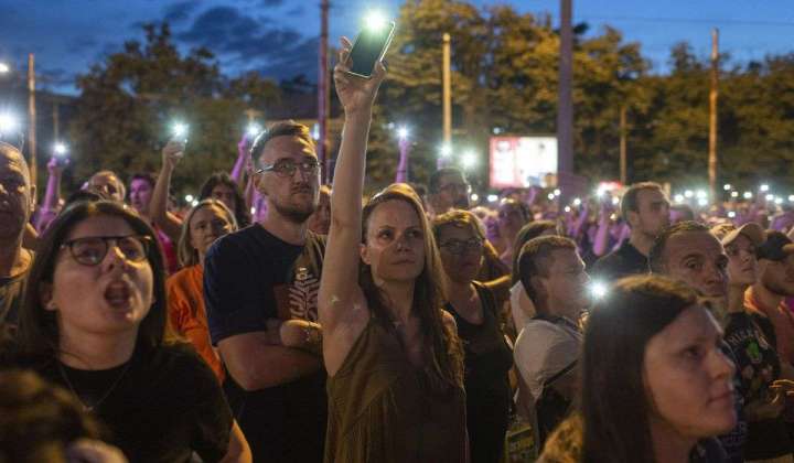Thousands in Serbian capital protest pro-government TV station after 2 mass shootings in May