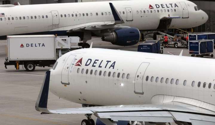 Delta Air Lines posts $1.11 billion profit for the third quarter and sees strong holiday bookings