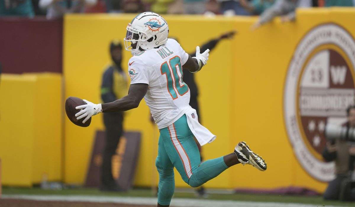 Hill has 2 TDs as Dolphins beat Commanders to move to 9-3 for the first time since 2001