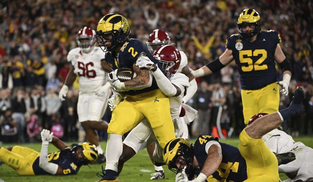 Michigan beats Alabama in overtime on Corum’s TD run to reach national title game